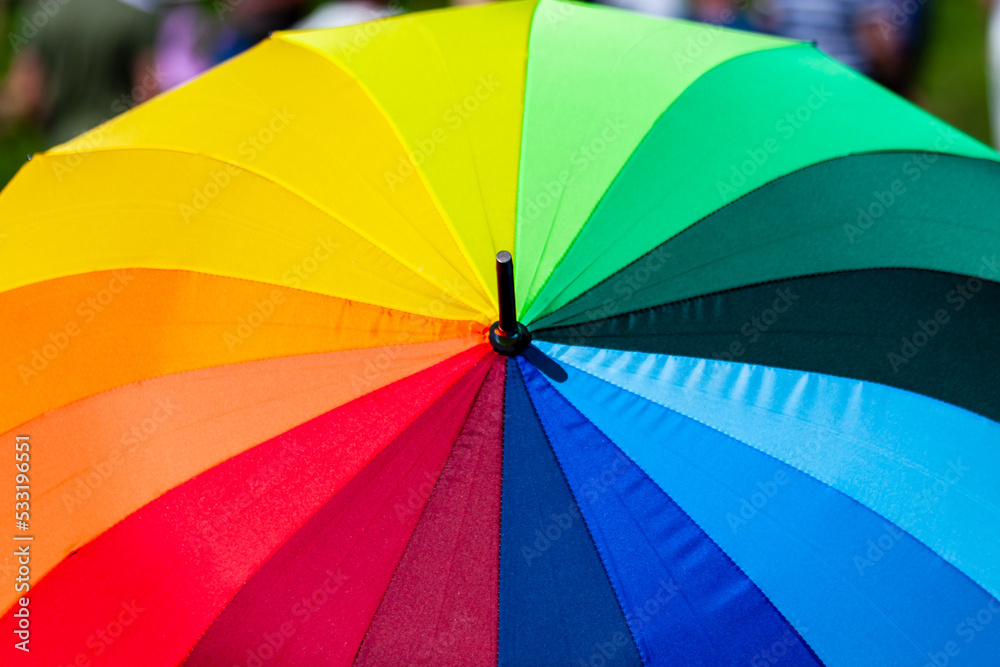 Umbrella painted in a spectrum. Umbrella in rainbow colors.