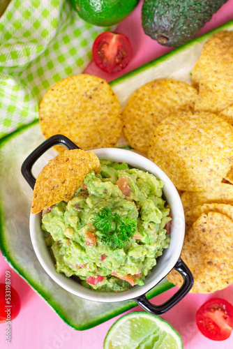 Traditional Mexican avocado dip Guacamole served with tortilla chips