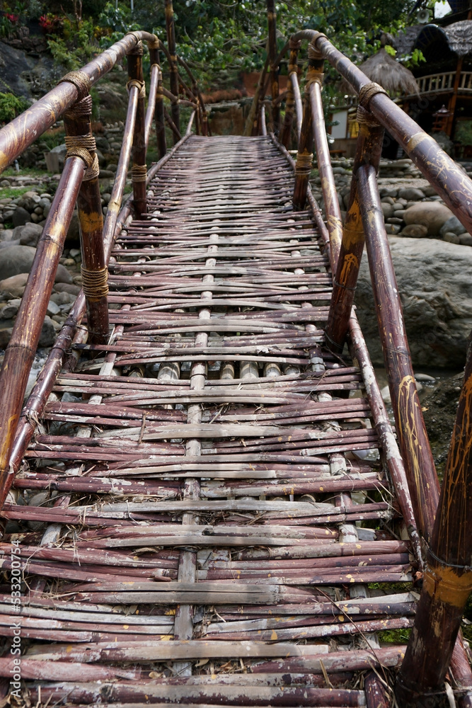 bamboo bridge on tropical river    