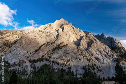 Last light of day illuminates a rock mountain peak in Idaho