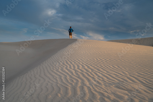Man Standing on Migrating Dune Råbjerg Mile, Denmark