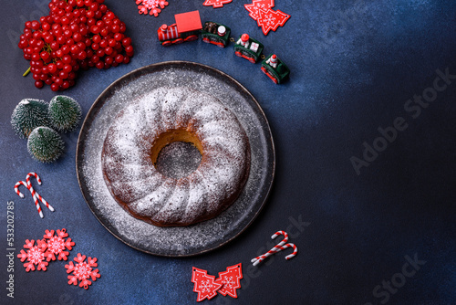 Homemade delicious round Christmas pie with red berries on a ceramic plate