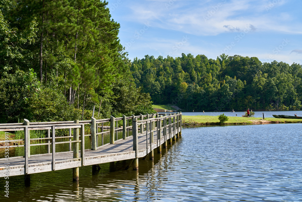 Wooden pier on lake McIntosh in Peachtree City Georgia. Wooden pier on lake McIntosh in Peachtree City Georgia.