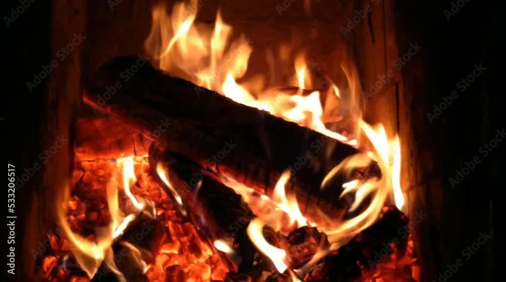 Burning wood burning fireplace in a warm house Burning wood burning fireplace in a warm house