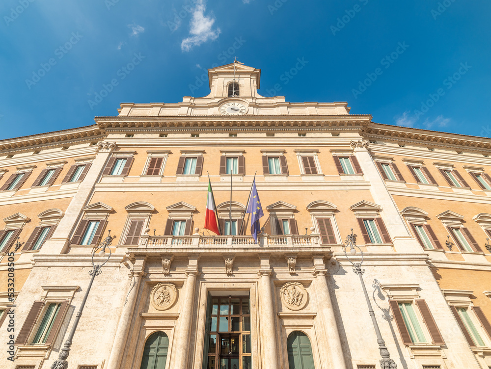 Montecitorio Palace under a blue sky with clouds