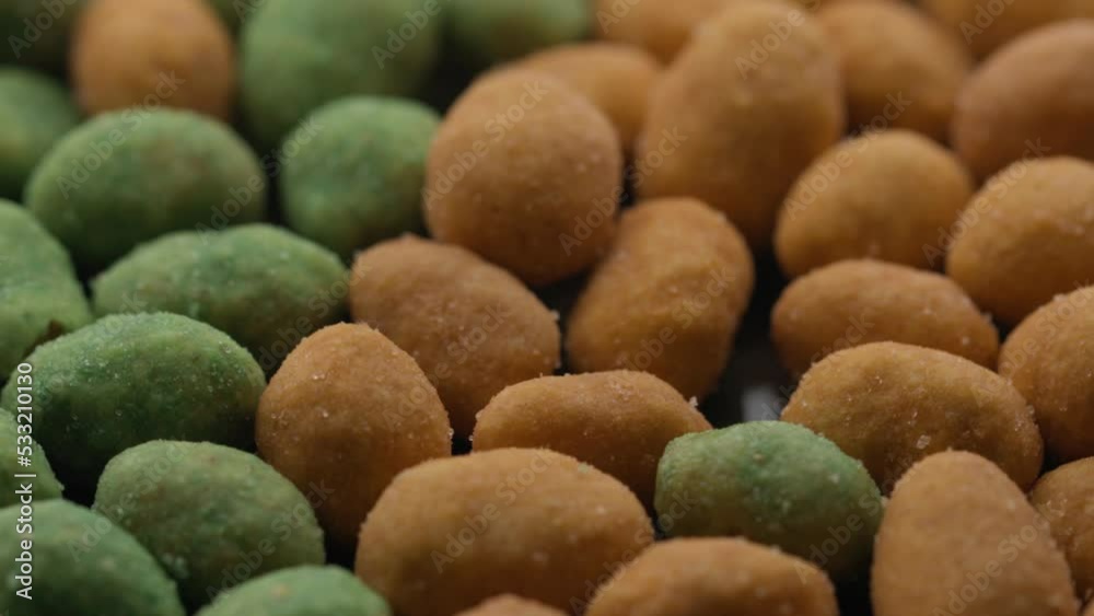 nuts with wasabi and pepper rotate in a circle. spicy snack nuts with wasabi and pepper rotate in a circle. spicy snack