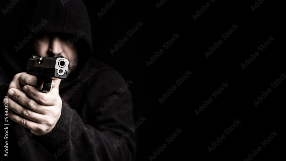 Man with gun, pointed at the camera Man with gun, pointed at the camera