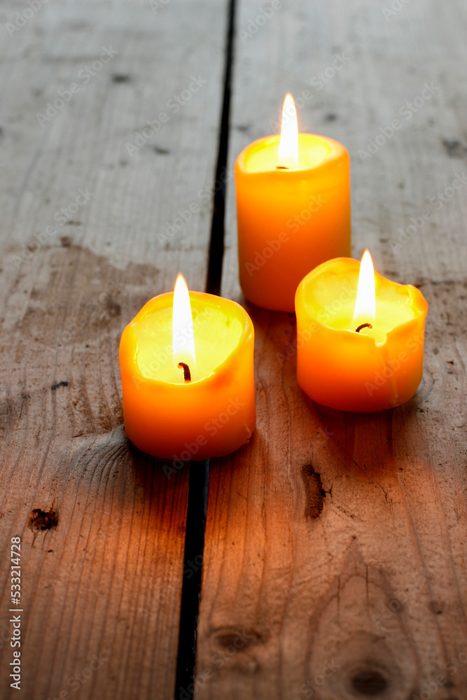 Candles on wooden table, cozy atmosphere. Candles on wooden table, cozy atmosphere.