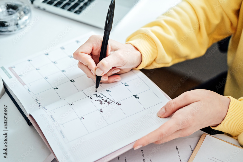 planner-calendar-with-text-job-interview-on-date-female-hands-writing-job-interview-date-on-a-calendar-woman-write-in-print-calendar-with-mark-and-job-interview-words-stock-photo-adobe