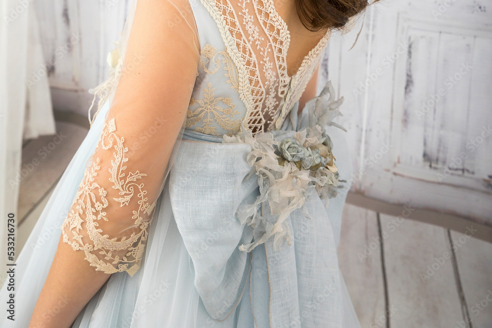 dress and outfit for holy Communion girl with blue flower belt Stock