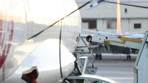 Close-up detail view of belt loading machine car load commercial parcel shipment in small cargo plane compartment. Air mail shipping and logistics service . Commercial charter flight service