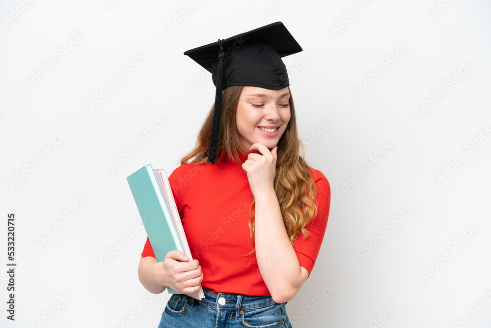 Young university graduate woman isolated on white background looking to the side and smiling Young university graduate woman isolated on white background looking to the side and smiling