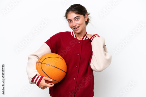 Young basketball player woman isolated on white background laughing