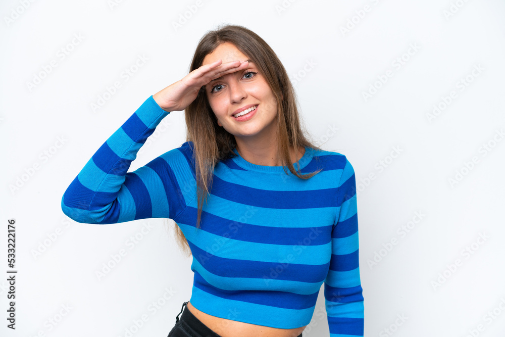 Young caucasian woman isolated on white background looking far away with hand to look something Young caucasian woman isolated on white background looking far away with hand to look something