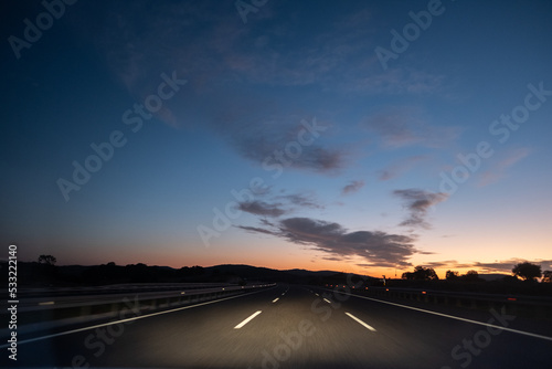 On the Road before Sunrise with cloudscape