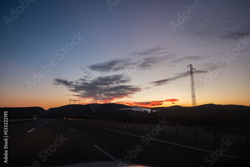 On the Road before Sunrise with cloudscape