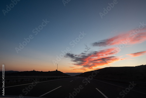 On the Road before Sunrise with cloudscape