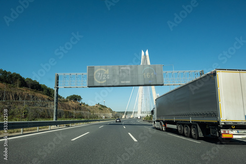Commercial Truck on road at the bridge entrance