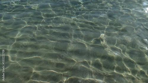 Close up of the  turquoise clear waters of Magganari Beach in Ios Greece photo