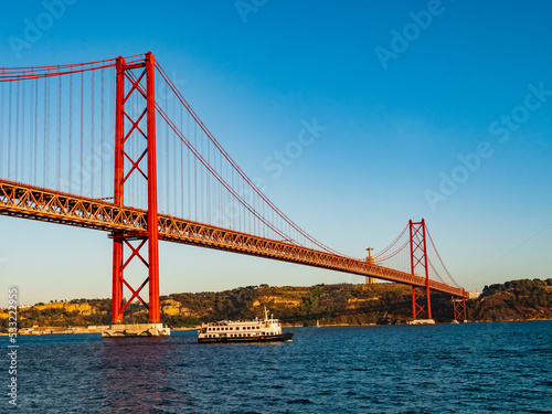 Fototapeta Naklejka Na Ścianę i Meble -  Stunning view of the 25 de Abril (25th April) suspension bridge crossing the Tagus river, Belem district, Lisbon, Portugal