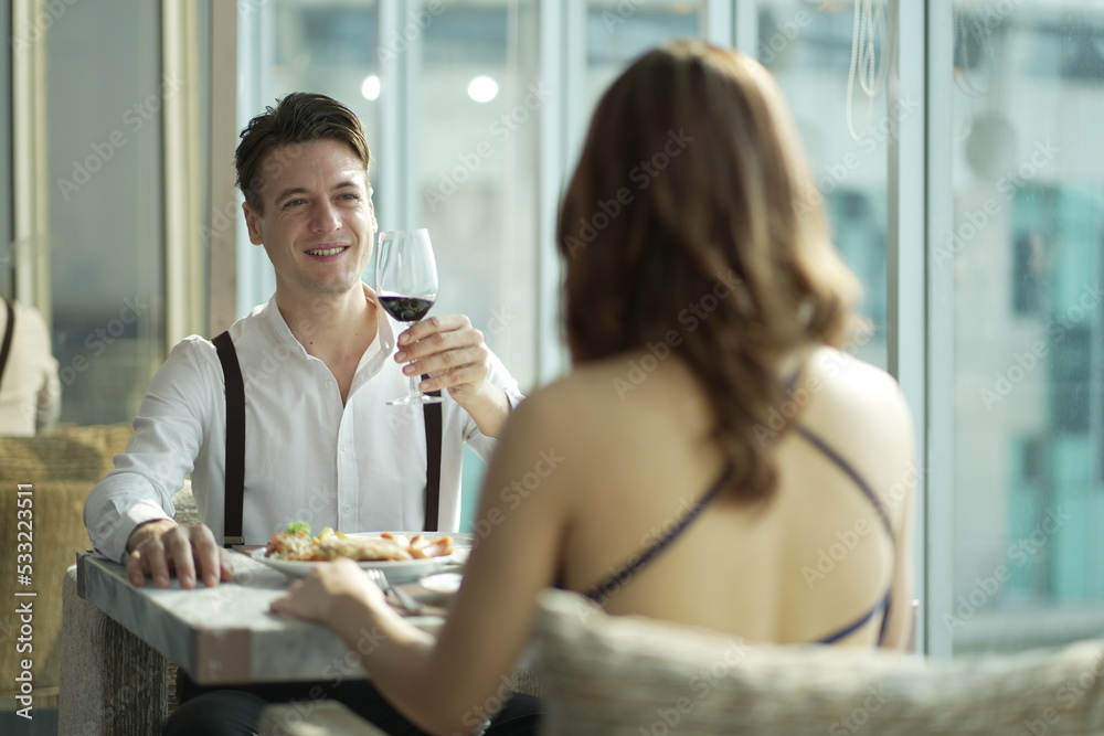 Couple dating and flirting in a restaurant. couple dating , propose marriage. Romantic couple on a date sitting in a restaurant. Couple dating and flirting in a restaurant. couple dating , propose marriage. Romantic couple on a date sitting in a restaurant.