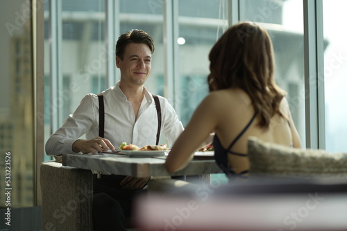 Free Download Couple dating and flirting in a restaurant. couple dating , propose marriage. Romantic couple on a date sitting in a restaurant. - GFXLoad