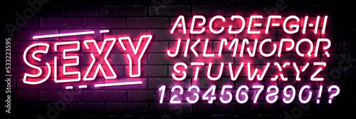 Vector realistic isolated neon sign of Sexy text with easy to change color alphabet font on the wall background.