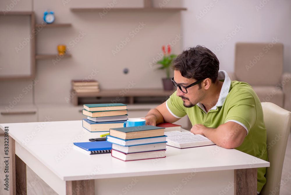 Young male student studying at home
