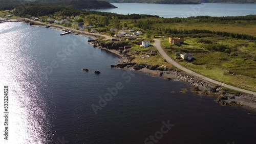 Aerial village with small road and docks in the Coastal town of Summerville Newfoundland Canada.
 photo