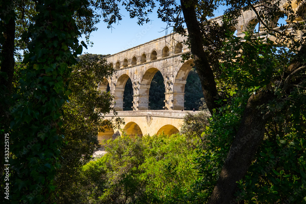 Obraz premium Roman aqueduct Pont du Gard and natural park in Languedoc, France
