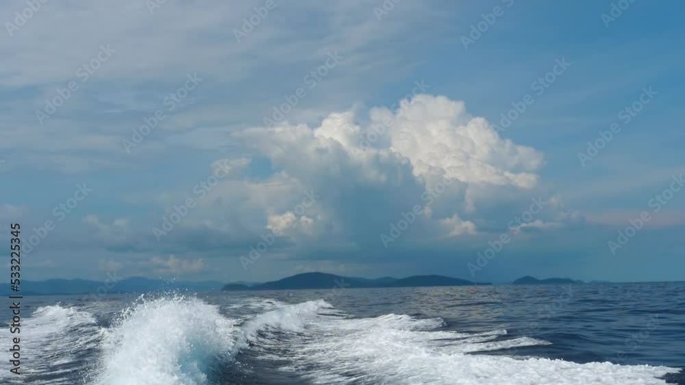 View of the waves from the speedboat. Beautiful landscape of the island. Tourism and travel concept View of the waves from the speedboat. Beautiful landscape of the island. Tourism and travel concept