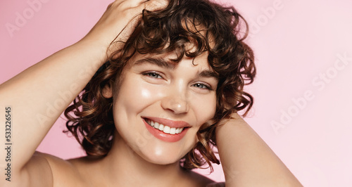 Canvas Print Close up of beauty girl with curly hair, using cosmetic treatment for perfect hairstyle