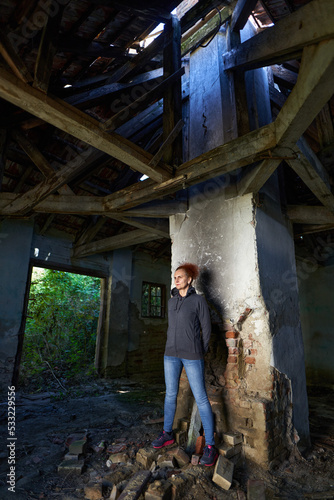 Woman in a ruined house