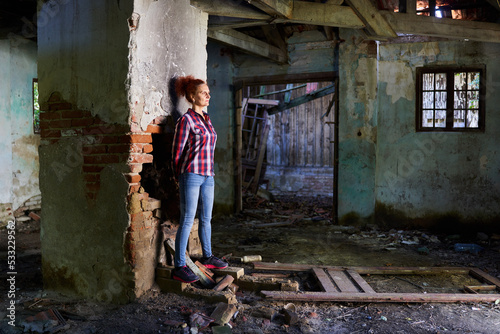 Woman in a ruined house