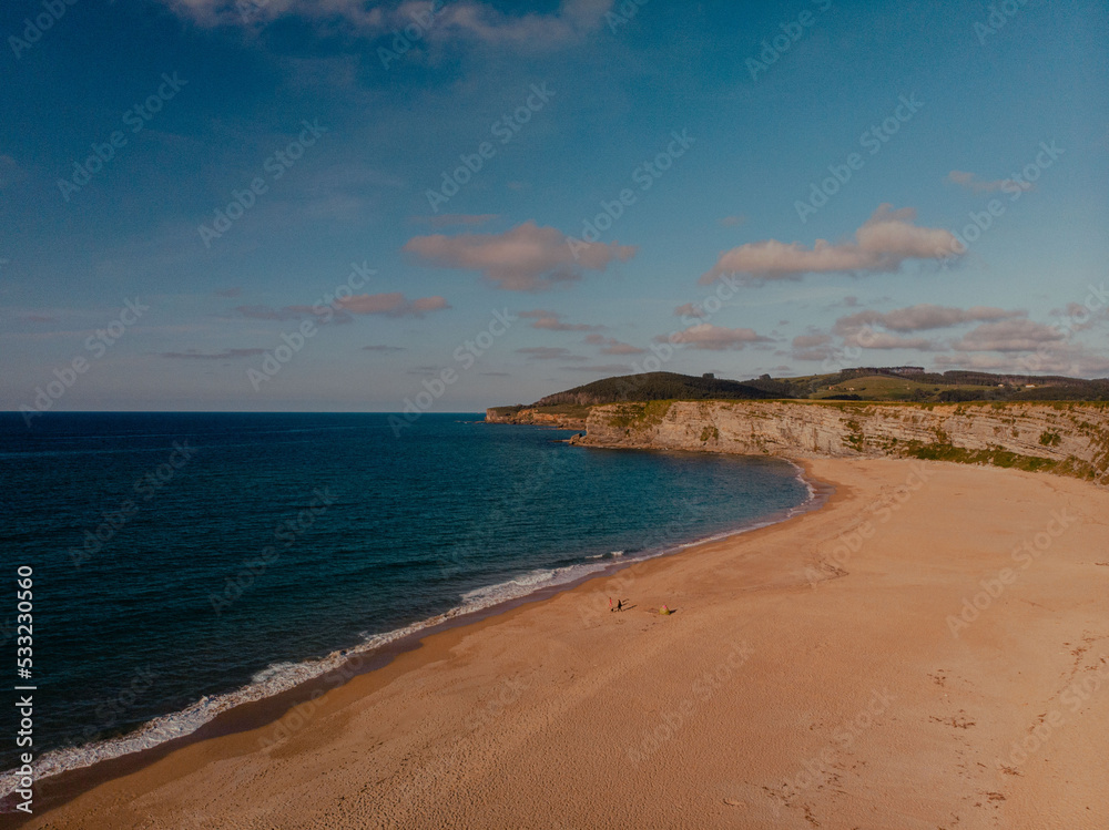 Panoramic view of the coast with cliffs overlooking the seaduring a surf and travel week experience in Somo, Cantabria (Spain)