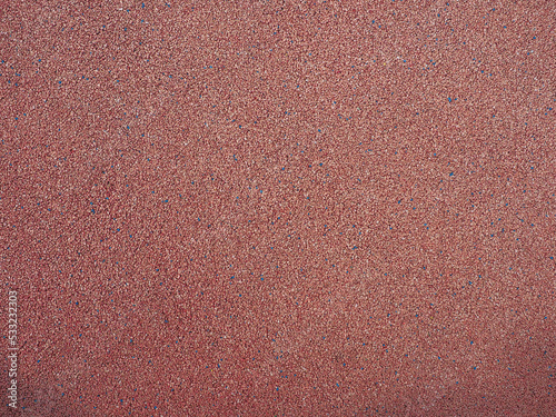 red pebbles texture background. park or playground flooring material