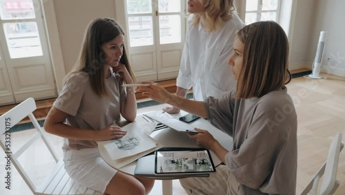 Female art business team discussing interior decoration for wedding decor arrangement