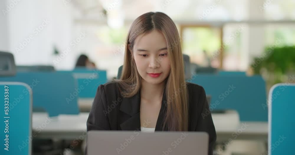 Beautiful confident, cheerful asian business woman open and typing on laptop in creative agency office. Female freelancer entrepreneur working on project paperwork making data analysis, Plan Strategy. Beautiful confident, cheerful asian business woman open and typing on laptop in creative agency office. Female freelancer entrepreneur working on project paperwork making data analysis, Plan Strategy.