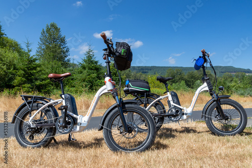 Two Folding Electric Bicycles Along the Centennial Trail