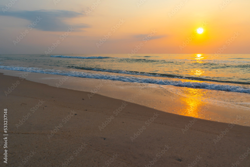 Summer time background with sun rises on the beach.