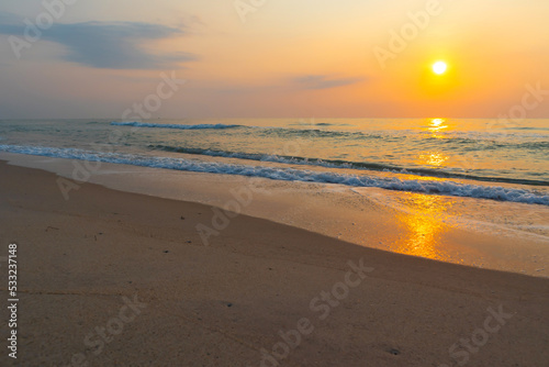 Summer time background with sun rises on the beach.