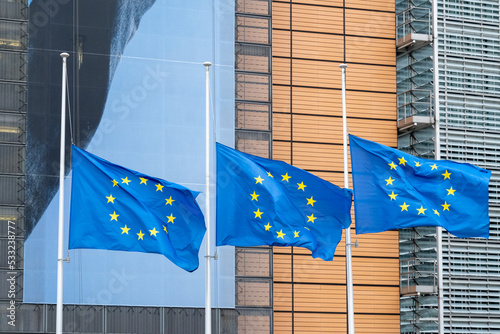 EU flags in front of European Commission in Brussels photo