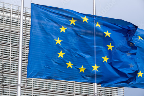 EU flags in front of European Commission in Brussels photo