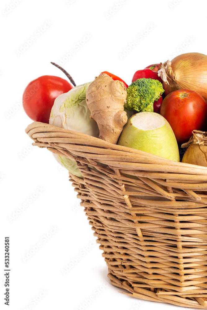 Healthy fresh organic vegetables in a crate isolated on white background