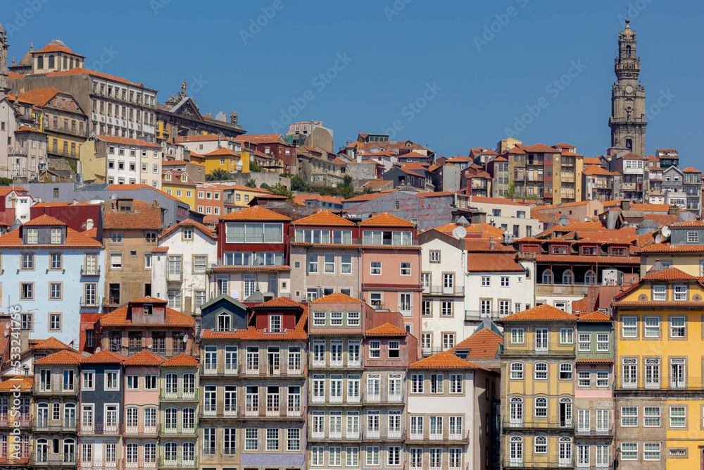 Summer cityscape, Narrow cobbled streets and houses in Porto, 
A coastal city in northwest Portugal known for its stately bridges and port wine production in the medieval Ribeira (riverside) district.