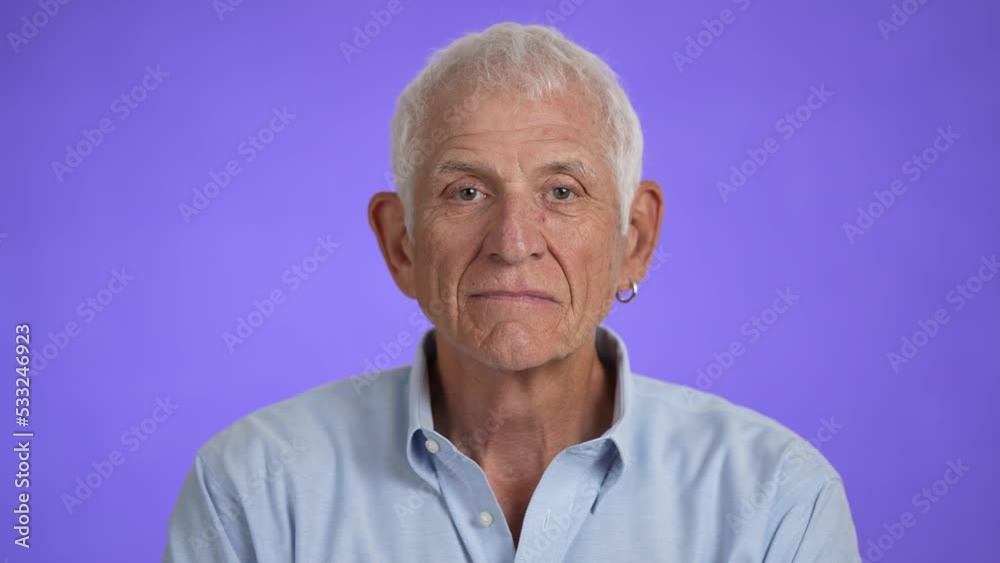 Closeup portrait of a smiling handsome middle aged man 70s. Mature caucasian man showing real emotions being happy, confident and likable. Closeup portrait of a smiling handsome middle aged man 70s. Mature caucasian man showing real emotions being happy, confident and likable.