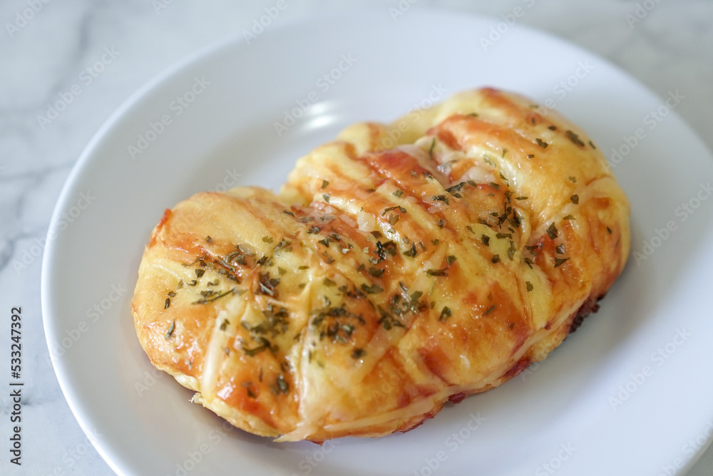 Sausage buns bread. Soft baked bun (dough) stuffed with sausage for fast food breakfast or coffee break. Sausage roll, (hot dog). With mayo, tomato sauce, mozarella cheese and parsley topping Sausage buns bread. Soft baked bun (dough) stuffed with sausage for fast food breakfast or coffee break. Sausage roll, (hot dog). With mayo, tomato sauce, mozarella cheese and parsley topping