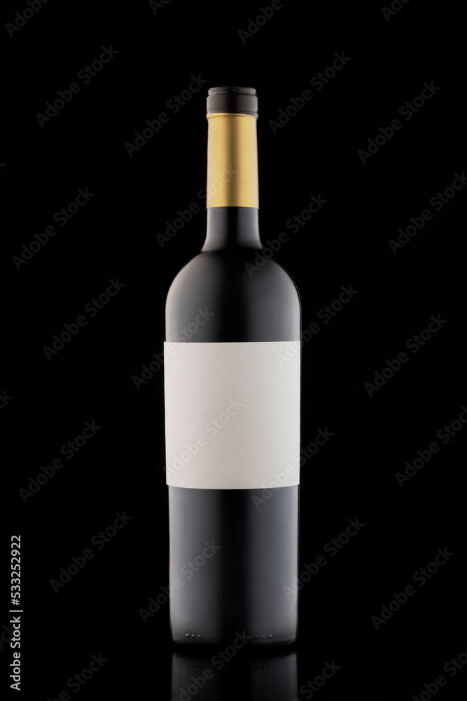 Bottle of red wine on a black background. Stylish alcohol Bottle of red wine on a black background. Stylish alcohol