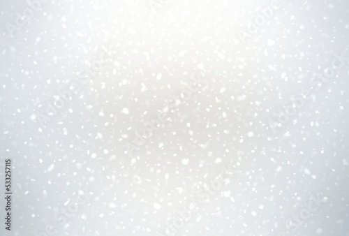 Falling snow particles motion on white shiny blank background. Light glowing textured airy backdrop for winter holidays.