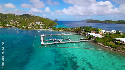 Beautiful circling aerial shot of St. Thomas East end beach aquarium in Coki beach with blue water blue sky photo